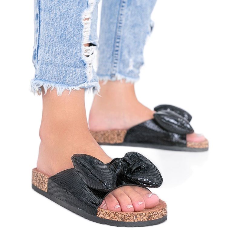 Fekete papucs íjjal Norris -tól