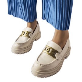 Inna Schlanders csattal díszített bézs naplopók