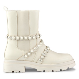 Bézs színű női bokacsizma dekoratív kiegészítőkkel