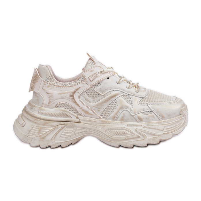 Bézs női tornacipő horzsolásokkal a platformon