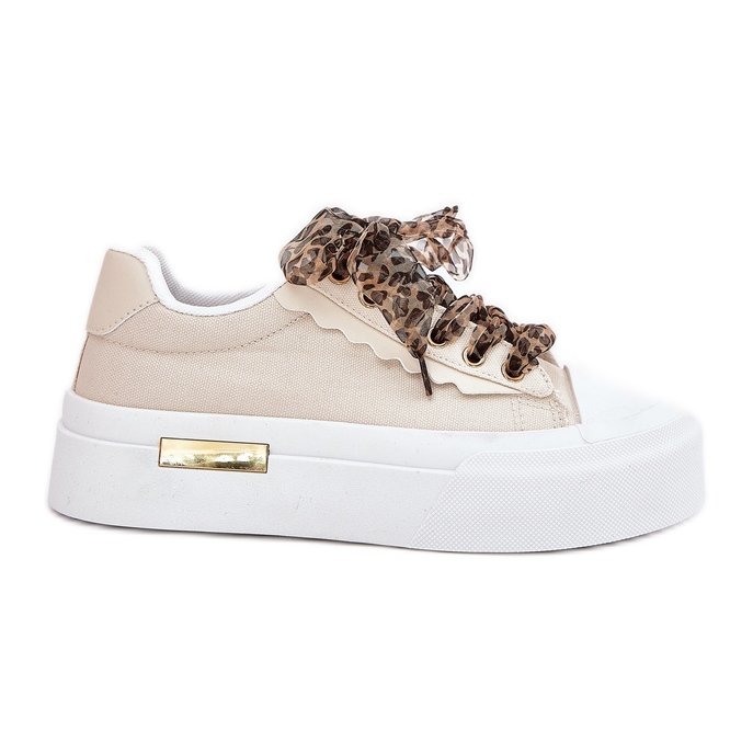 Női cipők egy hatalmas platformon, dekoratív kötéssel bézs