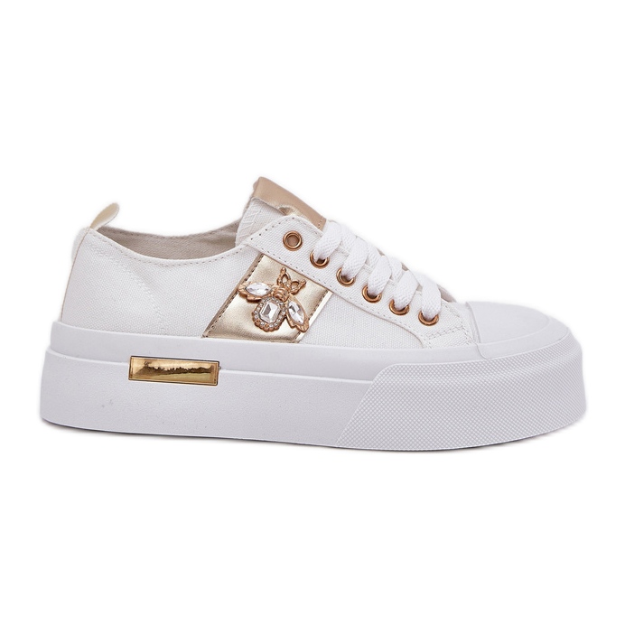 Női cipők a platformon, dekoratív részletekkel fehér