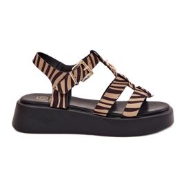 Női szandál a platformon, a bézs-fekete zebra arany részletével