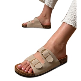 Bézs szárnyak bilincsekkel egy parafa talpon