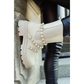 Bézs színű női bokacsizma dekoratív kiegészítőkkel 1