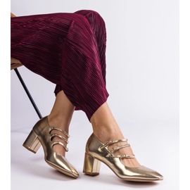 Aranyszivattyúk az oszlopon dekoratív csatokkal aranysárga 2