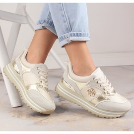 Női sportcipő arany platformon Potocki SZ12025 aranysárga 1